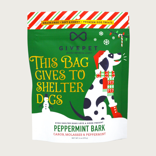 6 oz Christmas-themed bag of Peppermint Bark (carob, molasses & peppermint) dog treats by GivePet. Grain-free, soft & chewy, premium dog treats. Large text on front reads "This Bag Gives to Shelter Dogs".