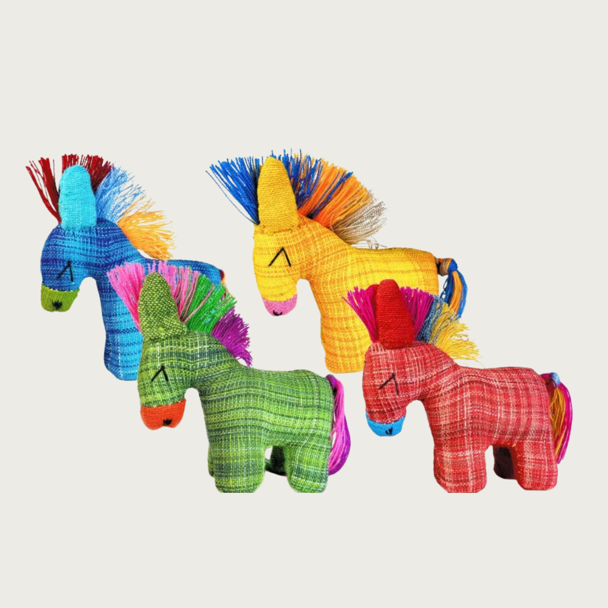 Four Dandi Donki woven donkey cat toys in different colors (blue, green, yellow, red) with thread mohawk-like manes & tails in contrasting colors, arranged in two overlapping rows.