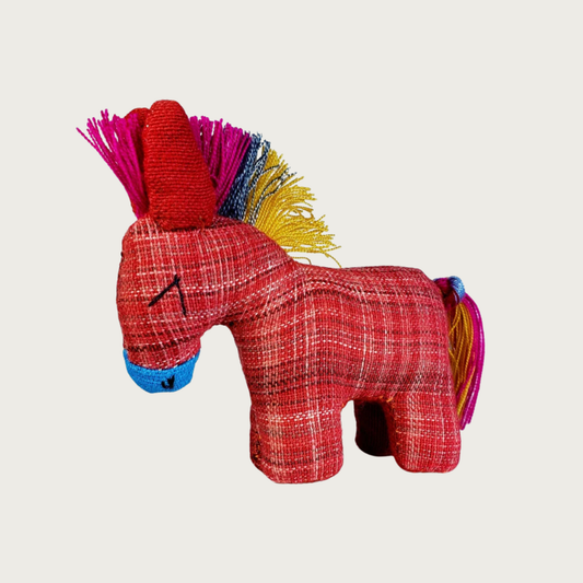 Dandi Donki woven fabric donkey cat toy in red with a vibrant multicolor mohawk-style mane and tail, and a blue nose and embroidered eyes.