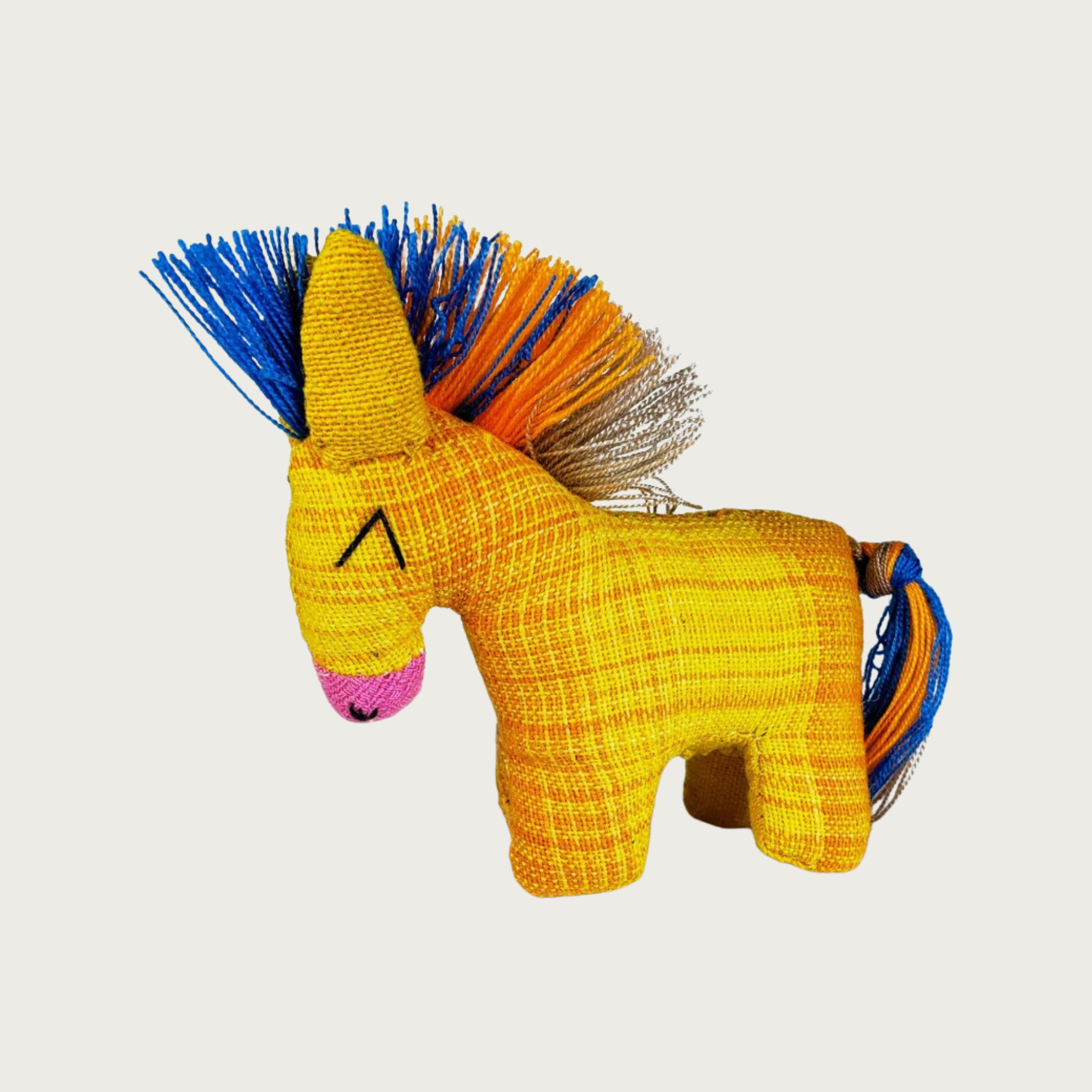 Dandi Donki woven fabric donkey cat toy in bright yellow with a vibrant multicolor mohawk-style mane and tail, and a pink nose and embroidered eyes.