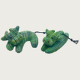 Load image into Gallery viewer, Two Holy Cow cat toys in green, side by side showing the available shapes: curved or laying flat.
