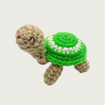 Load image into Gallery viewer, Crocheted Lil' Turtle cat toy with a tan body and a bright green shell featuring a white circle and embroidered eyes & mouth.
