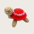 Load image into Gallery viewer, Crocheted Lil' Turtle cat toy with a tan body and a bright red shell featuring a white circle and embroidered eyes & mouth.
