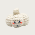 Load image into Gallery viewer, A crocheted garlic bulb cat toy in white yarn with embroidered smiling face.
