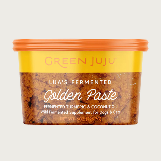 Yellow-orange colored plastic tub of Green Juju Lua's Fermented Golden Paste, fermented turmeric & coconut oil. Wild fermented supplement for dogs & cats. Net Wt. 6 oz.
