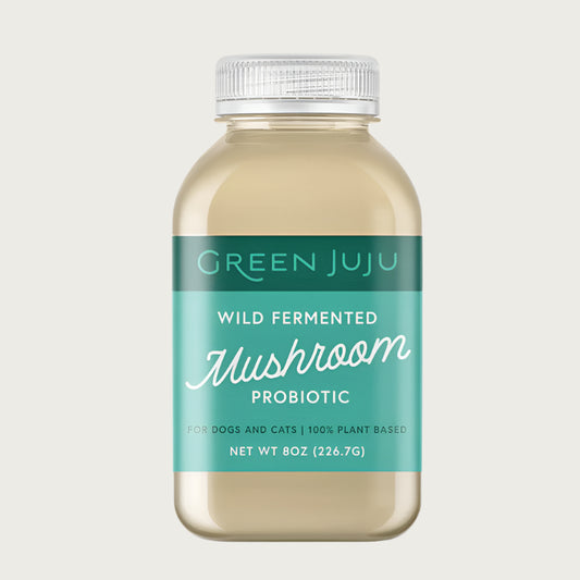 Green Juju liquid mushroom probiotic for dogs and cats, in an 8 ounce bottle. 100% plant based and made with wild-fermented mushrooms.