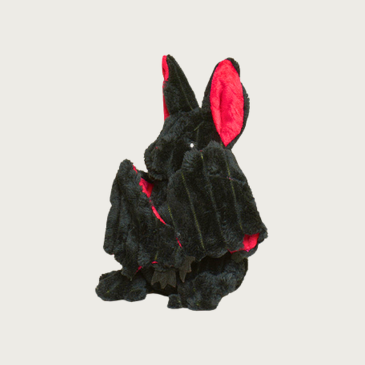 Side view of Batilda Bat dog toy with its wings closed in.