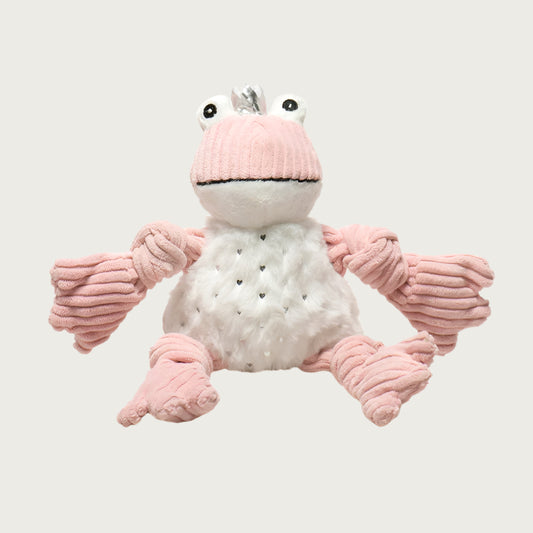 Plush dog toy frog with blush pink corduroy arms, legs & face, and white plush body accented with tiny silver hearts. It has bulging frog eyes and is wearing a small silver fabric crown. Size small.