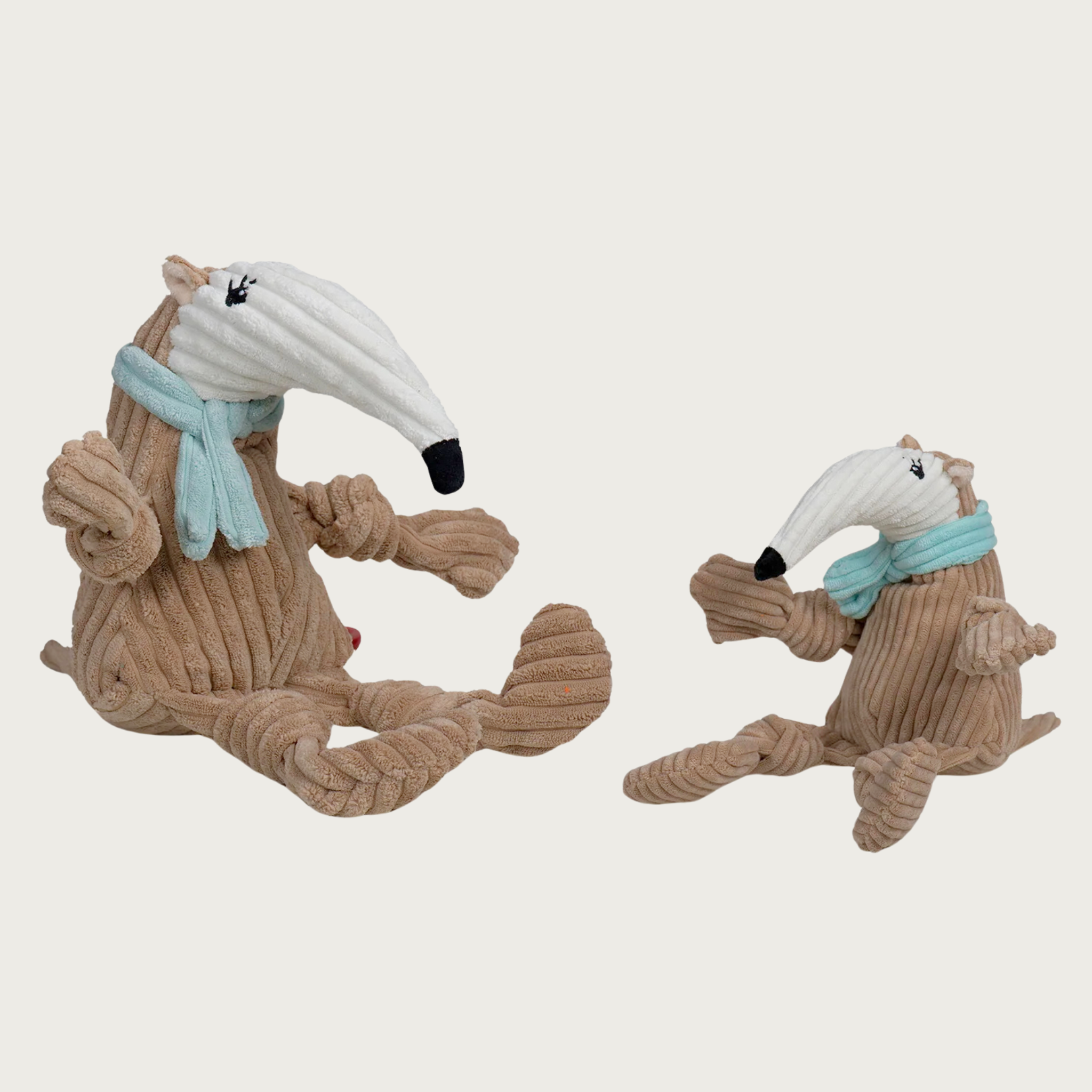Small and Large Nibblet Anteater dog toys side by side and facing each other to show size difference.