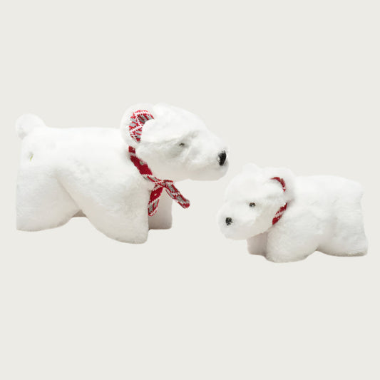 Small and large Squooshie Polar Bear dog toys sitting side by side to show size difference.