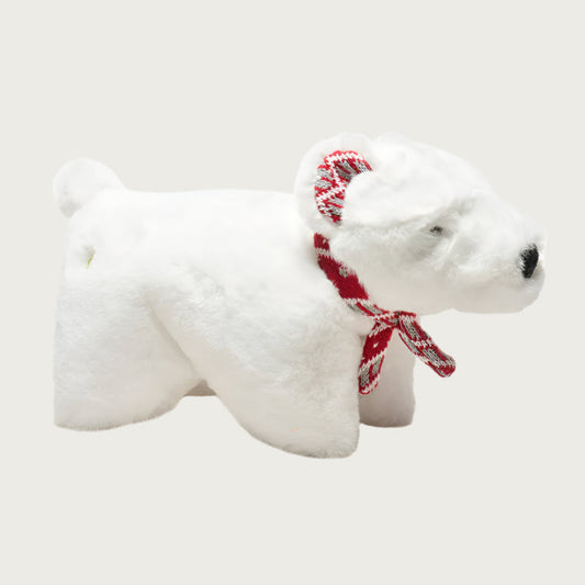Polar bear plush dog toy with a red, white & gray Nordic print scarf.