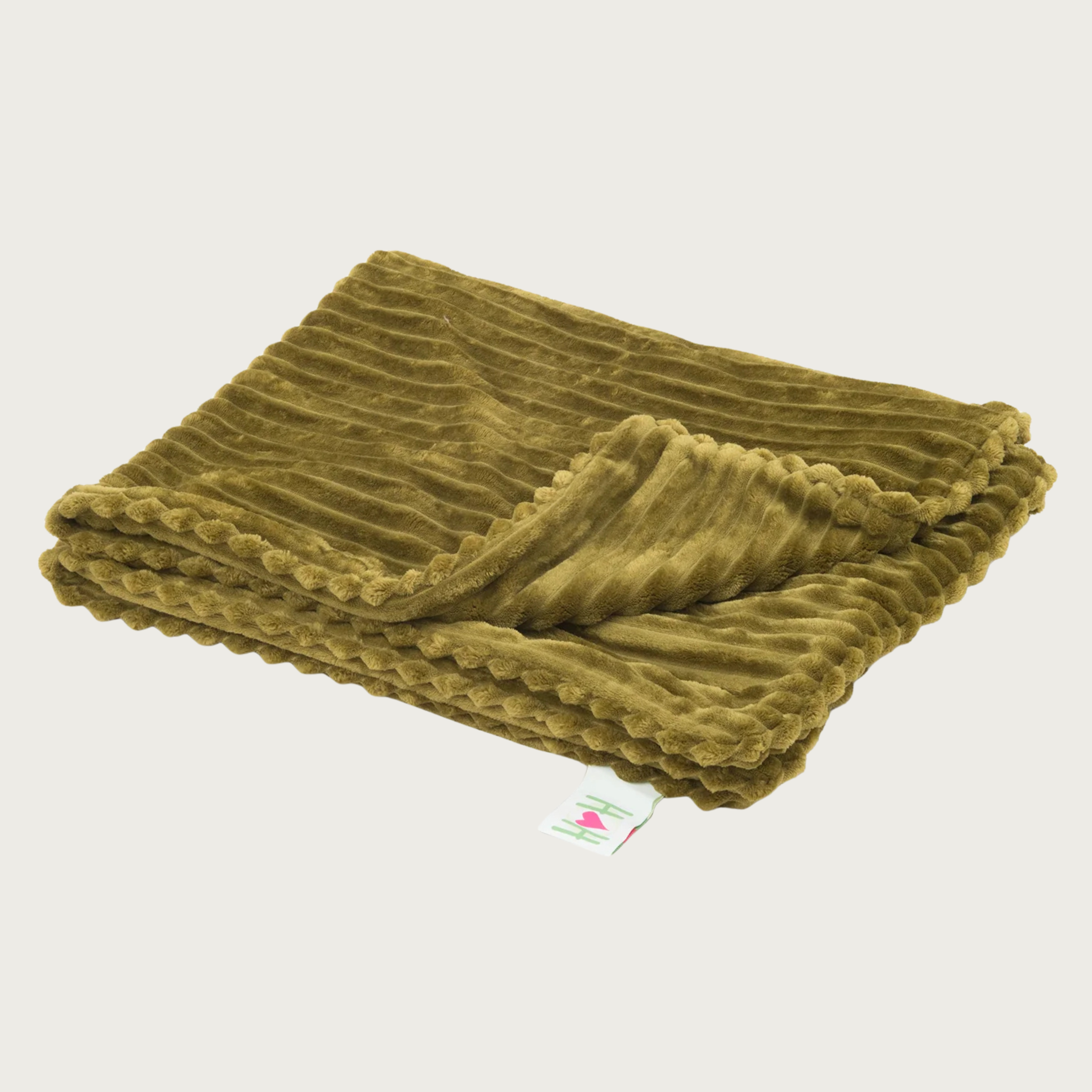 Folded wide-wale plush corduroy olive green blanket with one corner folded back, and a Hugglehounds brand tag on the end.