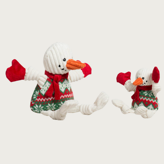Small and large Wintergreen Snowman dog toys sitting side by side to show size difference.