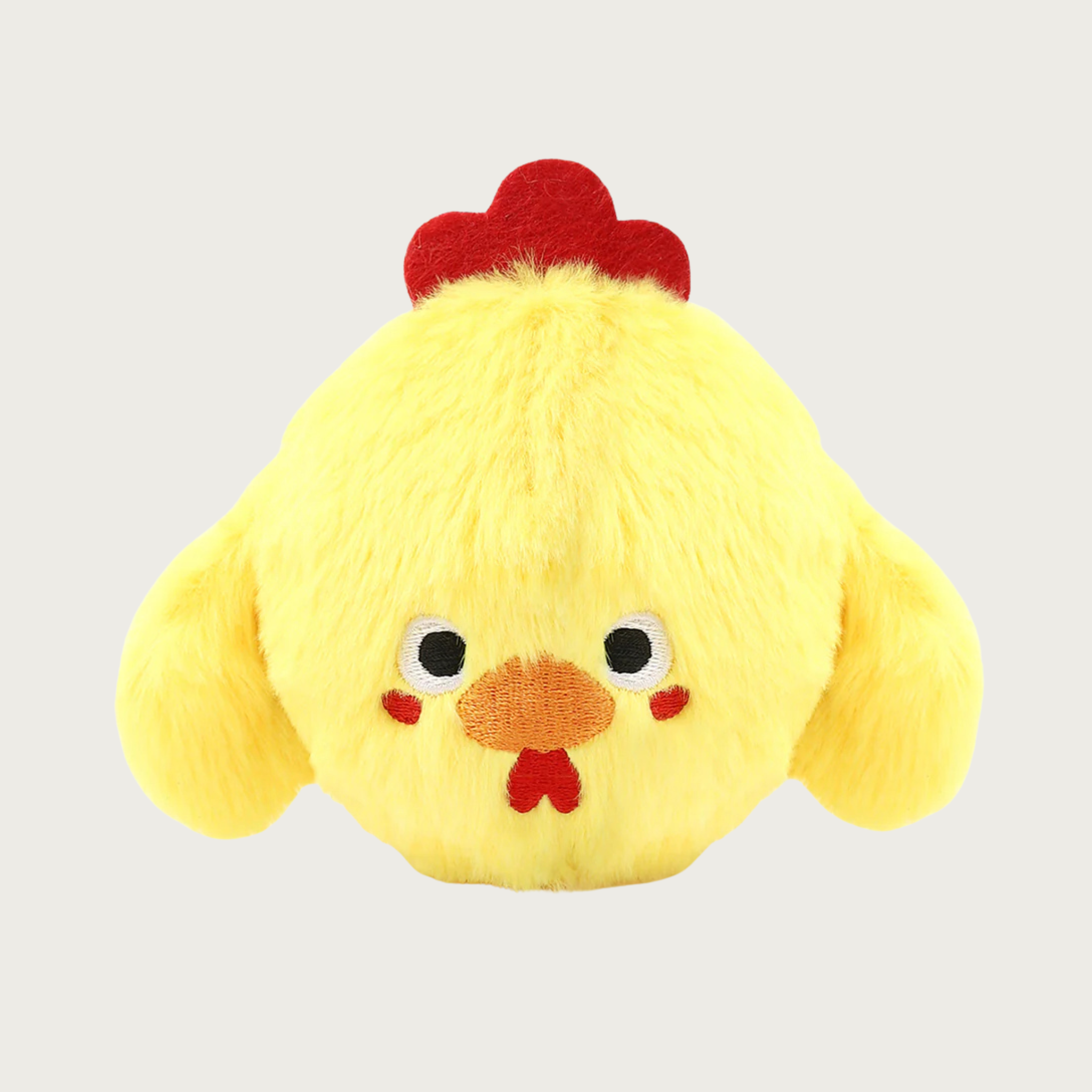 Yellow, round plush dog toy that looks like a chicken, with wings, a red comb on its head and cute embroidered facial expression.