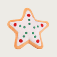 Load image into Gallery viewer, Star shaped plush dog toy, designed to look like a decorated sugar cookie. It is white with red & green dot accents along each of the star's 5 arms. 

