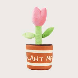 Plush dog toy - pink tulip flower on green stem, tucked inside a brown flower pot that says "plant me".