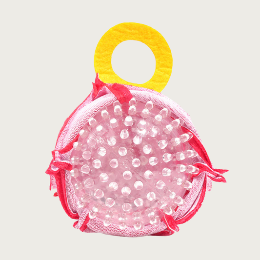 Vday Ring dog toy opened up to expose the clear, spiky rubber ball inside.