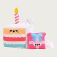 Load image into Gallery viewer, Additional view of the cake slice dog toy, with the small, plush gift box that will be found inside, once the dog tears the cake open. The gift box is pink with pink & blue ribbon and a smiley face.
