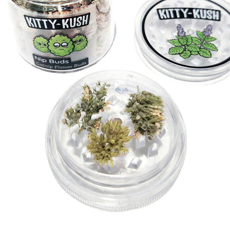 Closeup of 3 catnip buds in open, disc shaped grinder. Lid is off to see interior wide "teeth" used for grinding.