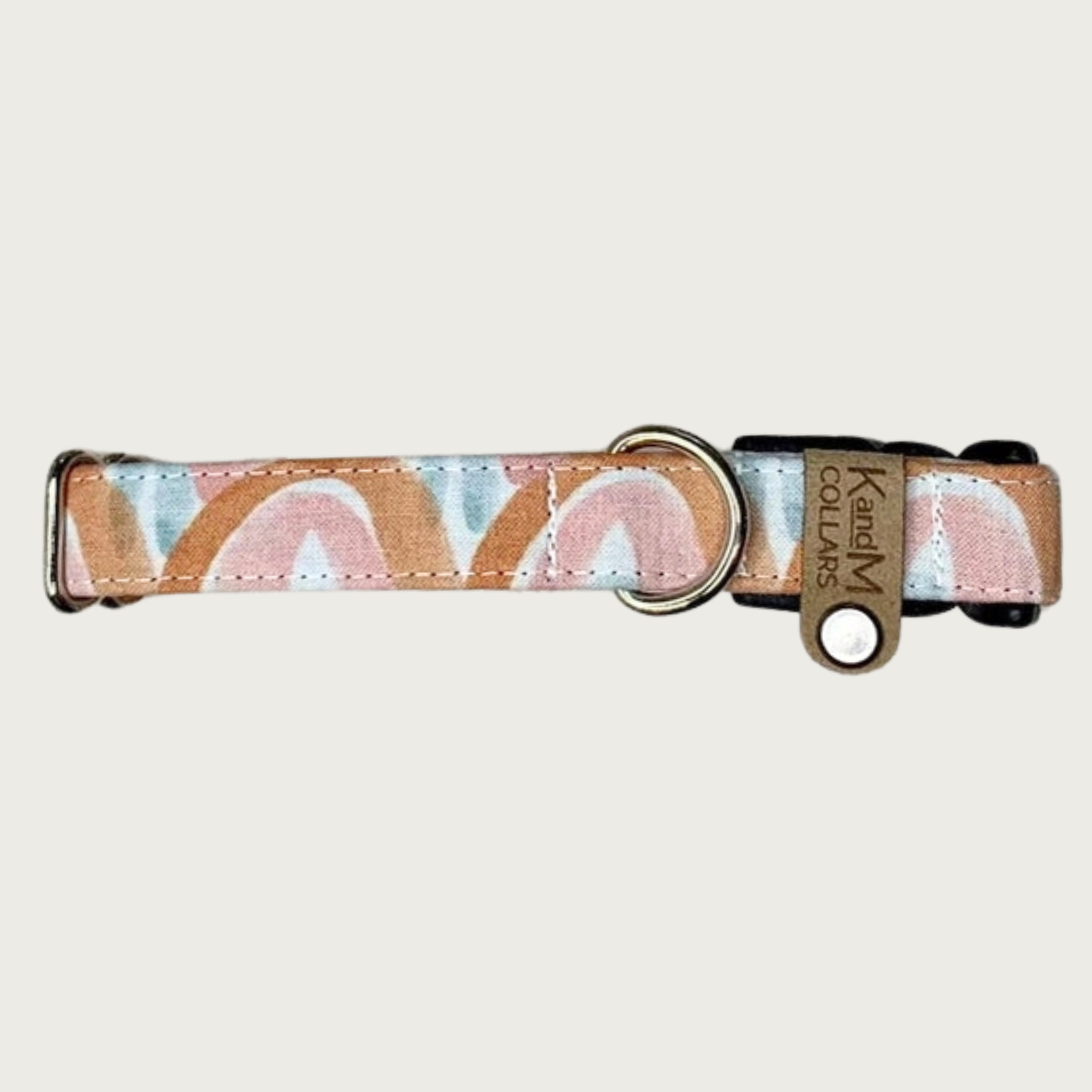 0.75" width dog collar with a repeating watercolor-inspired rainbow pattern, in soft shades of rust, mauve, light blue and white.