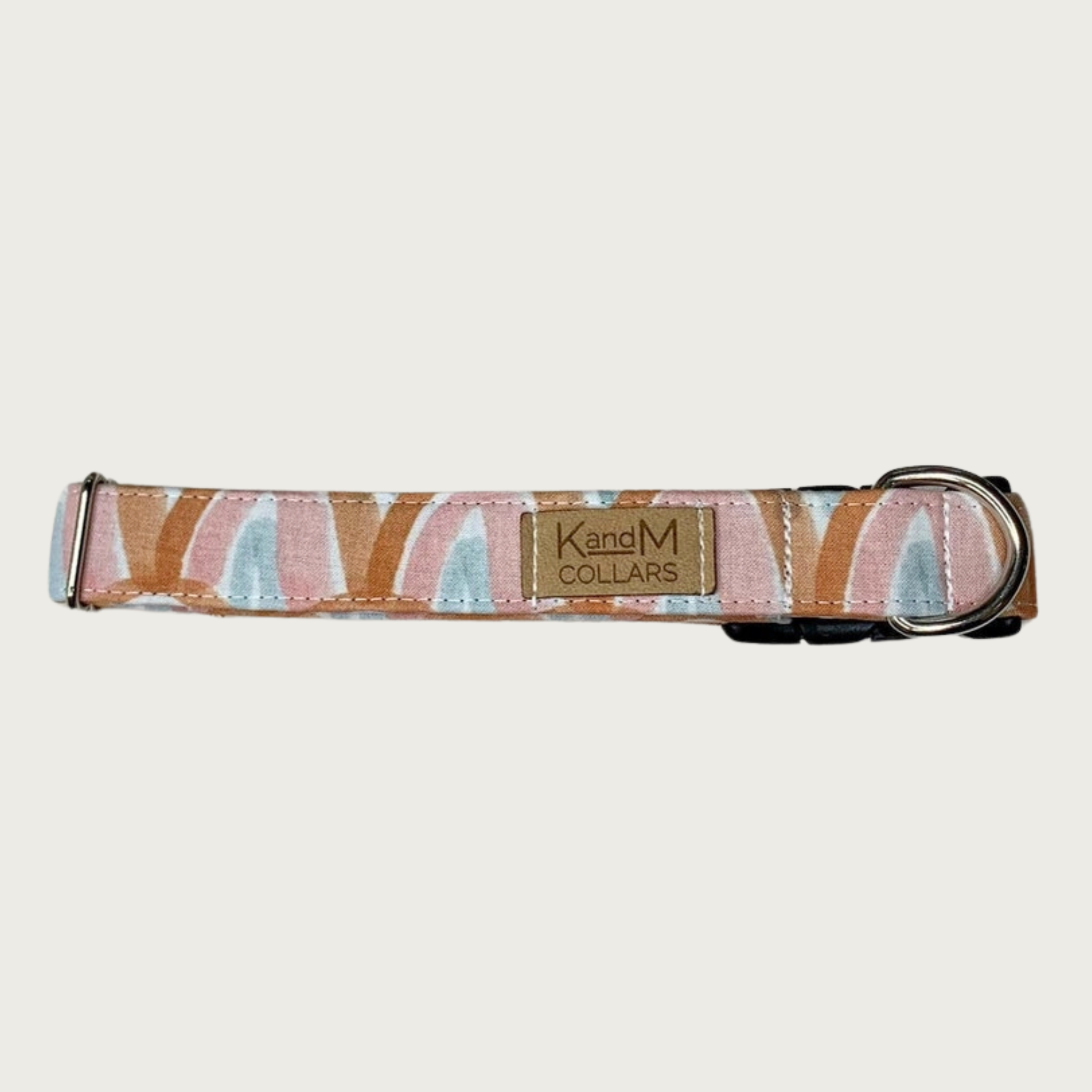 1" width dog collar with a repeating watercolor-inspired rainbow pattern, in soft shades of rust, mauve, light blue and white.