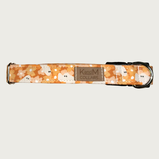 1in width, dog collar with floral pattern in shades of orange, with white ghosts, stainless d-ring and black plastic buckle.