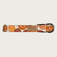 Load image into Gallery viewer, 1" width dog collar featuring pumpkins in various shades of orange, each with a classic smiley face.
