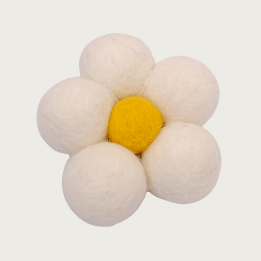 Cream collar flower for dogs, made from 5 felted wool balls with yellow center. Looks like a daisy.