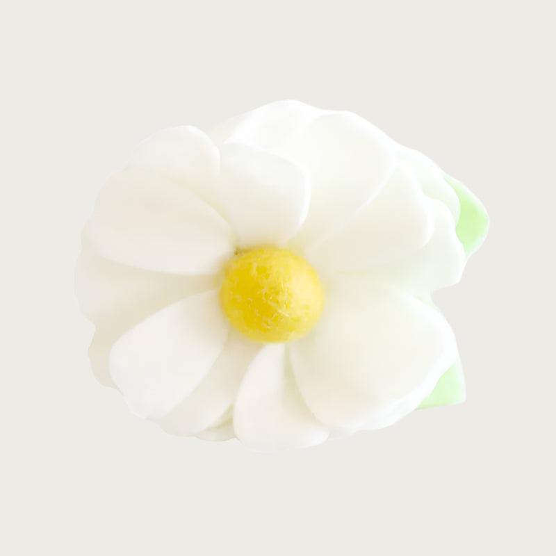 Cream felt collar flower with a yellow center and green leaf.