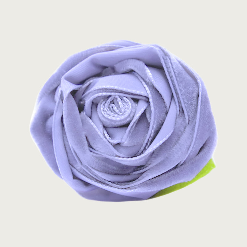 Violet purple velvet dog collar flower with green leaves.
