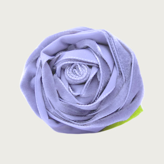 Violet purple velvet dog collar flower with green leaves.