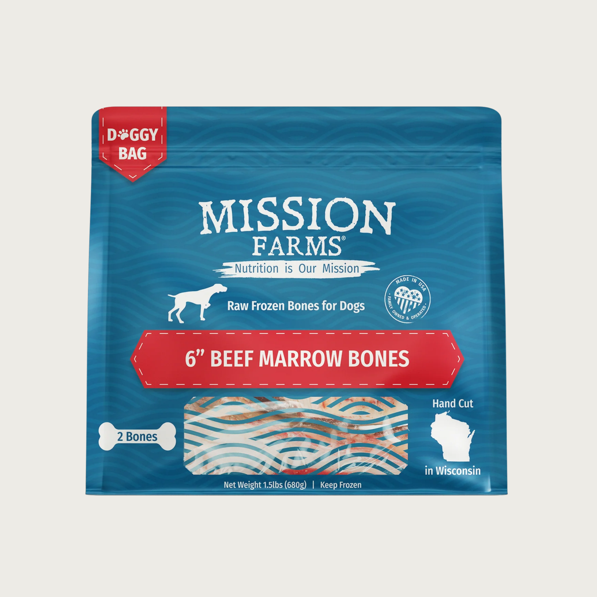 Blue bag with red accents, of Mission Farms, Raw Frozen Bones for Dogs; 6" Beef Marrow Bones. Small transparent window shows bones inside. 2 bones in bag, hand cut in Wisconsin. Net wt. 1.5 lbs.