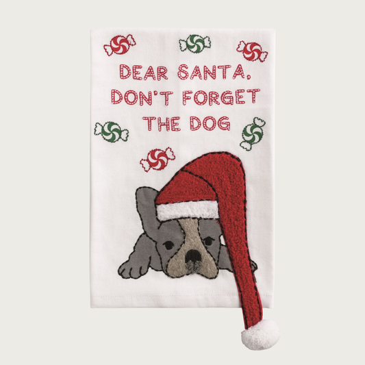 Christmas-themed white decorative towel, with a French Bulldog wearing a Santa hat and text 'Dear Santa, Don't Forget The Dog'. Red and green peppermint candy details are floating around the text.