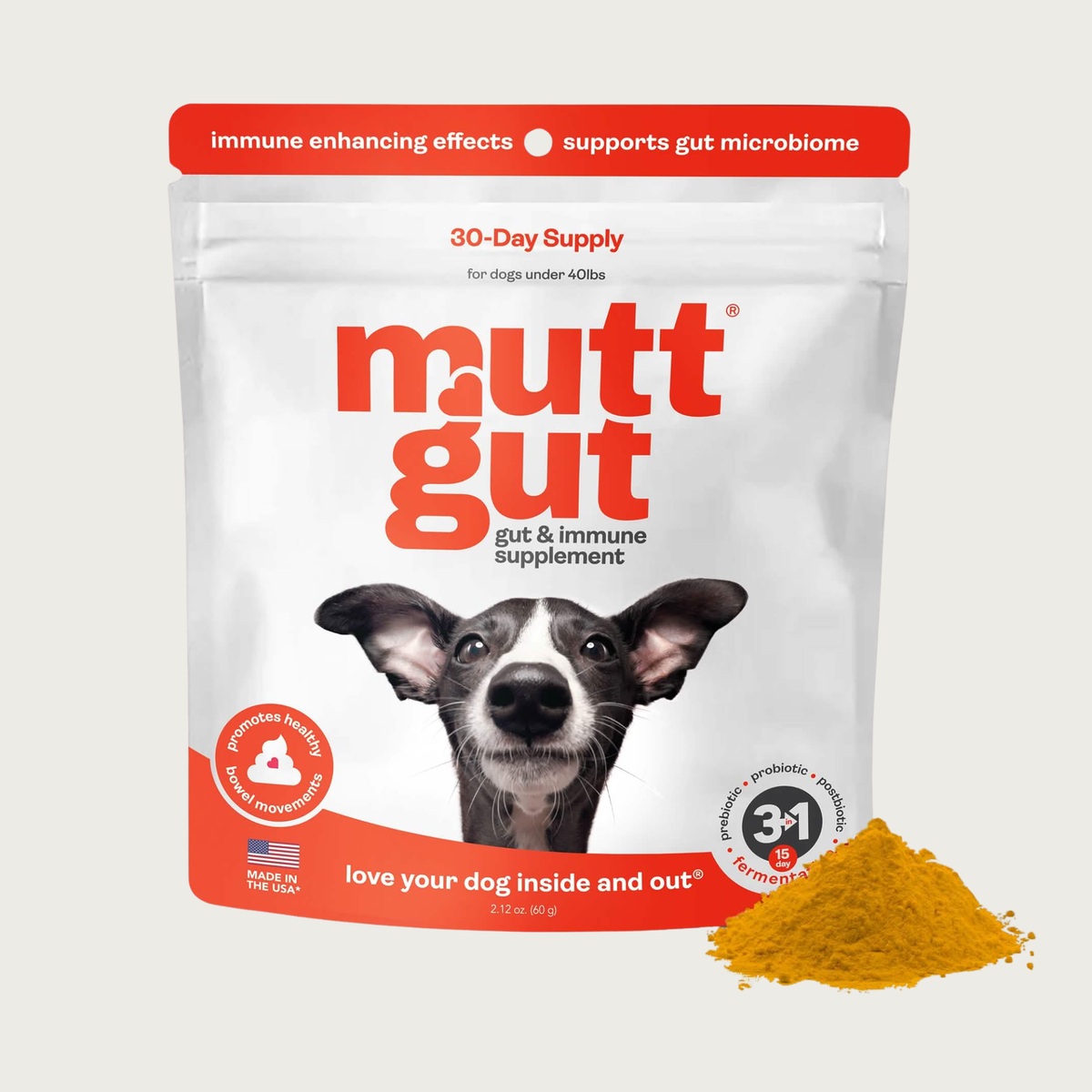 White resealable bag with bright orange accents, of Mutt Gut Gut & Immune Supplement. Features a photo of an Italian Greyhound's face looking straight ahead, with big ears. 30 day supply for dogs under 40 lbs. Immune enhancing effects, supports gut microbiome. Promotes healthy bowel movements. A small pile of the supplement powder is at the lower right side of the bag. It is brownish-orange in color.