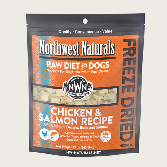 A 12 ounce bag of Northwest Naturals freeze-dried raw diet for dogs, chicken and salmon recipe. Clear window on bag shows small cube-sized nuggets.