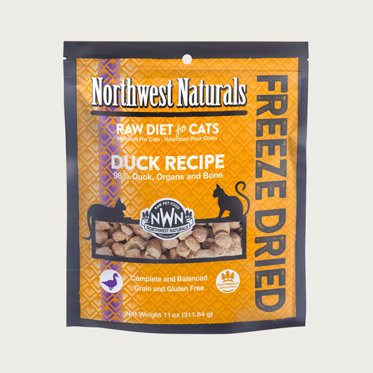 An 11 ounce orange bag of Northwest Naturals freeze-dried raw diet for cats, duck recipe. Clear window on bag shows small bite-sized nibbles.