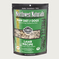 Load image into Gallery viewer, A 25 ounce bag of Northwest Naturals freeze-dried raw diet for dogs, lamb recipe. Clear window on bag shows small cube-sized nuggets.
