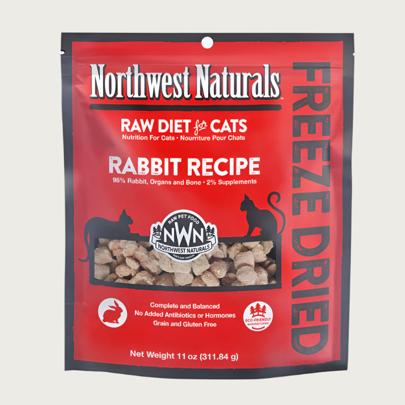 An 11 ounce bag of Northwest Naturals freeze-dried raw diet for cats, rabbit recipe. Clear window on bag shows small bite-sized nibbles.