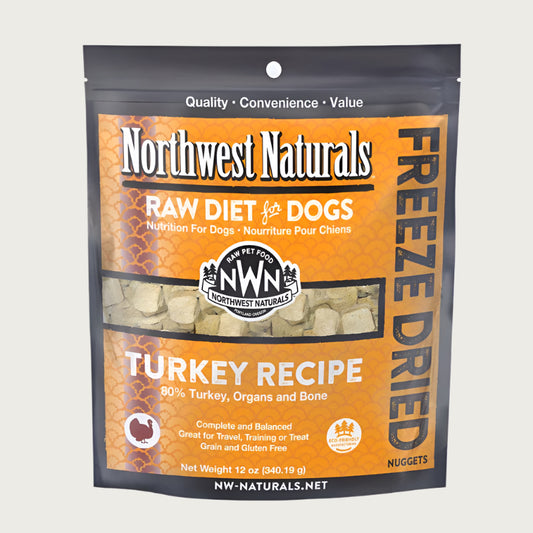 A 12 ounce bag of Northwest Naturals freeze-dried raw diet for dogs, turkey recipe. Clear window on bag shows small cube-sized nuggets.