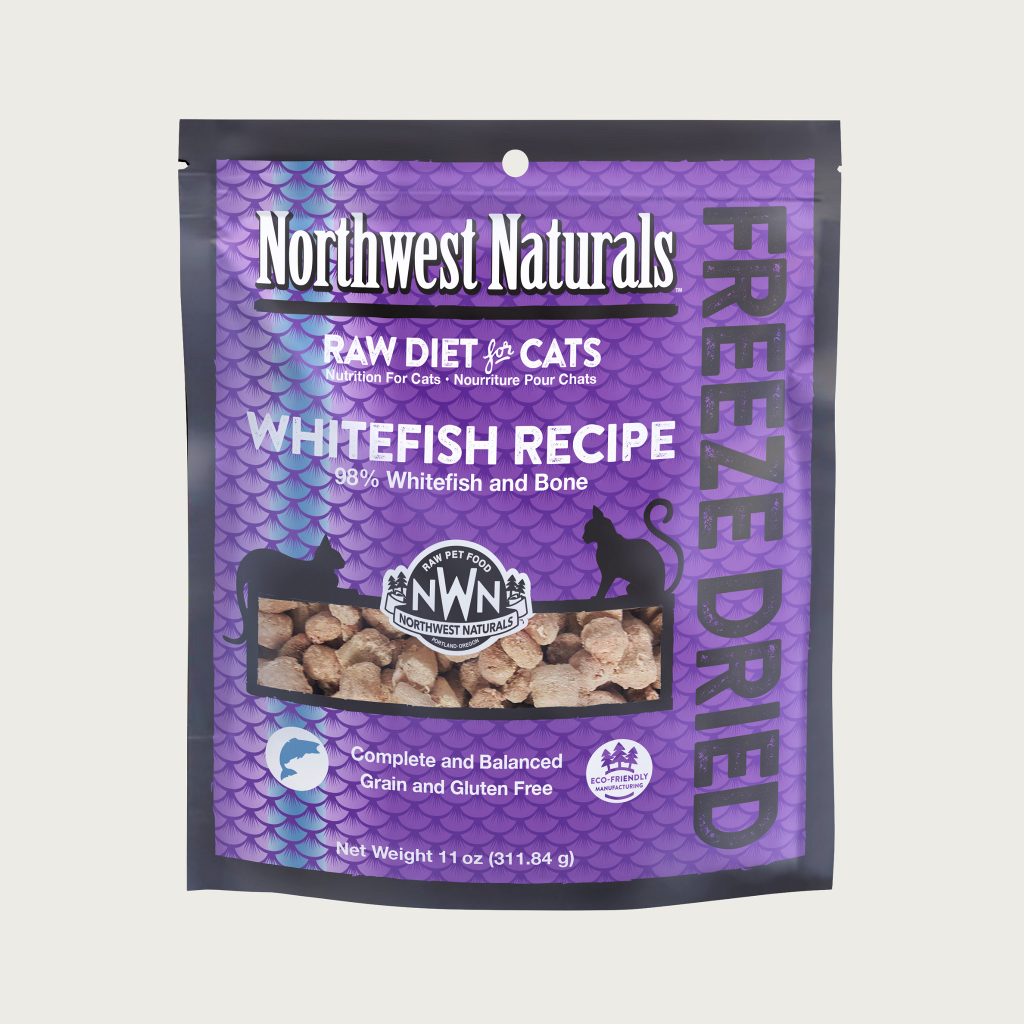 An 11 ounce purple bag of Northwest Naturals freeze-dried raw diet for cats, whitefish recipe. Clear window on bag shows small bite-sized nibbles.