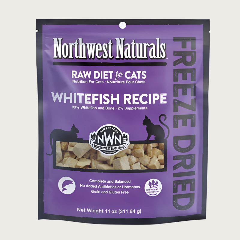 An 11 ounce bag of Northwest Naturals freeze-dried raw diet for cats, whitefish recipe. Clear window on bag shows small bite-sized nibbles.