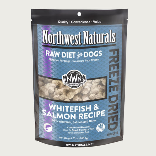 A 25 ounce bag of Northwest Naturals freeze-dried raw diet for dogs, whitefish and salmon recipe. Clear window on bag shows small cube-sized nuggets.