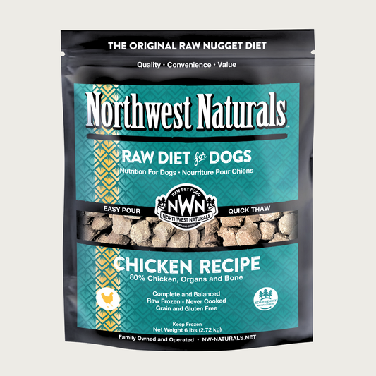 A 6 pound teal bag of Northwest Naturals frozen raw diet for dogs, chicken recipe. Clear window on bag shows small cube-sized nuggets.