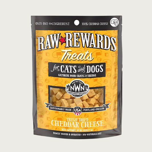 A 6 ounce bag of Northwest Naturals freeze-dried cheddar cheese bites for dogs and cats. Clear window on bag shows bite-sized cubes of cheese.
