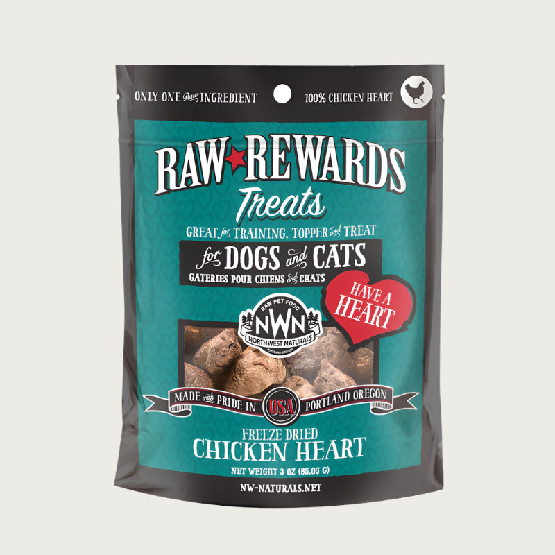 A 3 ounce bag of Northwest Naturals freeze-dried raw chicken heart treats for dogs and cats. Clear window on bag shows small rectangular shaped pieces.