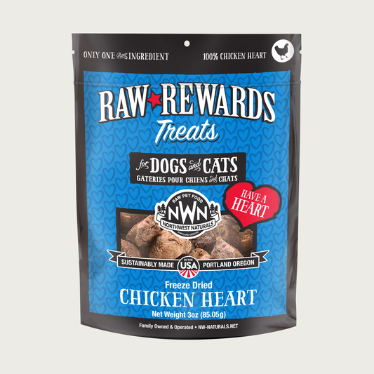 A 3 ounce blue bag of Northwest Naturals freeze-dried raw chicken heart treats for dogs and cats. Clear window on bag shows small rectangular shaped pieces.