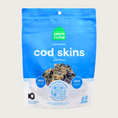 Load image into Gallery viewer, A 2.2.5 oz blue & white bag of Open Farm Dehydrated Cod Skins Dog Treats. Small photo in center shows a close-up of a few of the square shaped treats.
