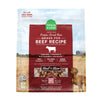 A 13.5 oz bag of Grain Free, Open Farm Freeze-Dried-Raw Grass-Fed Beef Recipe dog food. Meal or Mixer, Humanely raised and sustainably sourced. A photo of a Vizsla dog standing in a field on a farm covers the bag, with a red bar in the center to highlight the white text over it.