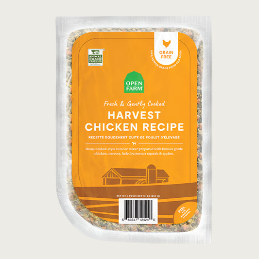 A 16 oz clear pouch of Open Farm Fresh & Gently Cooked Harvest Chicken Recipe. Yellow label covers the front, with product details: Grain Free, 100% Human Grade Food for Dogs, Animal Welfare Certified. Peel corner to open pouch.