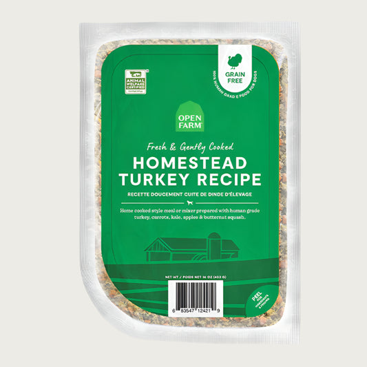 A 16 oz clear pouch of Open Farm Fresh & Gently Cooked Homestead Turkey Recipe. Green label covers the front, with product details: Grain Free, 100% Human Grade Food for Dogs, Animal Welfare Certified. Peel corner to open pouch.